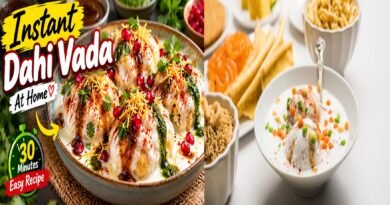 Homemade soft Dahi Vada topped with creamy yogurt, tamarind chutney, green chutney and Indian spices.